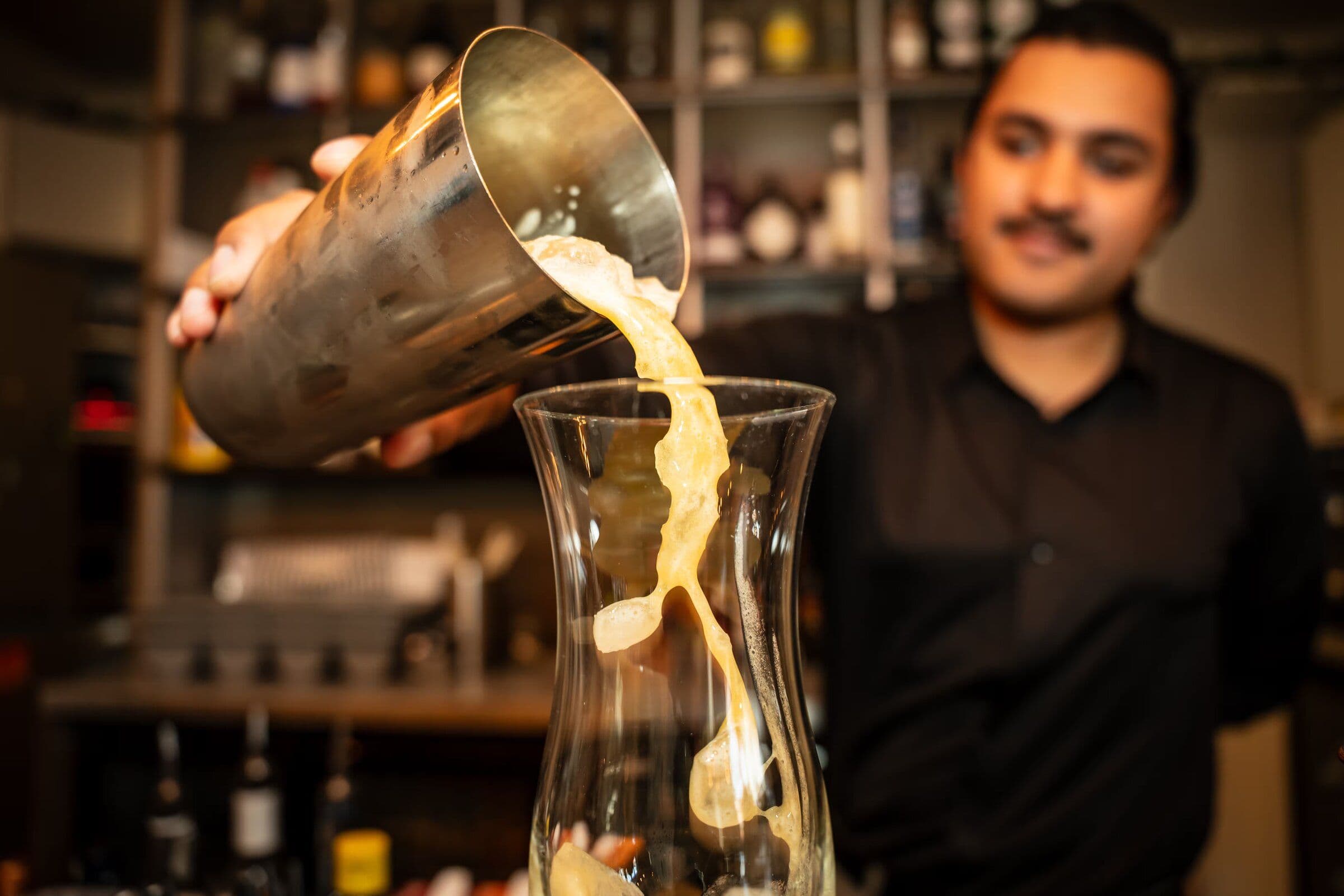 A cocktail being finished at the Taste Social bar